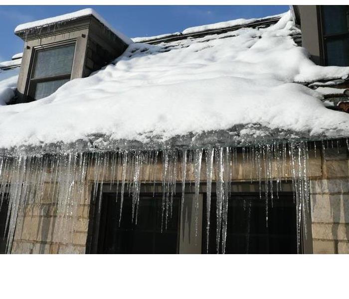 home with ice dams on roof